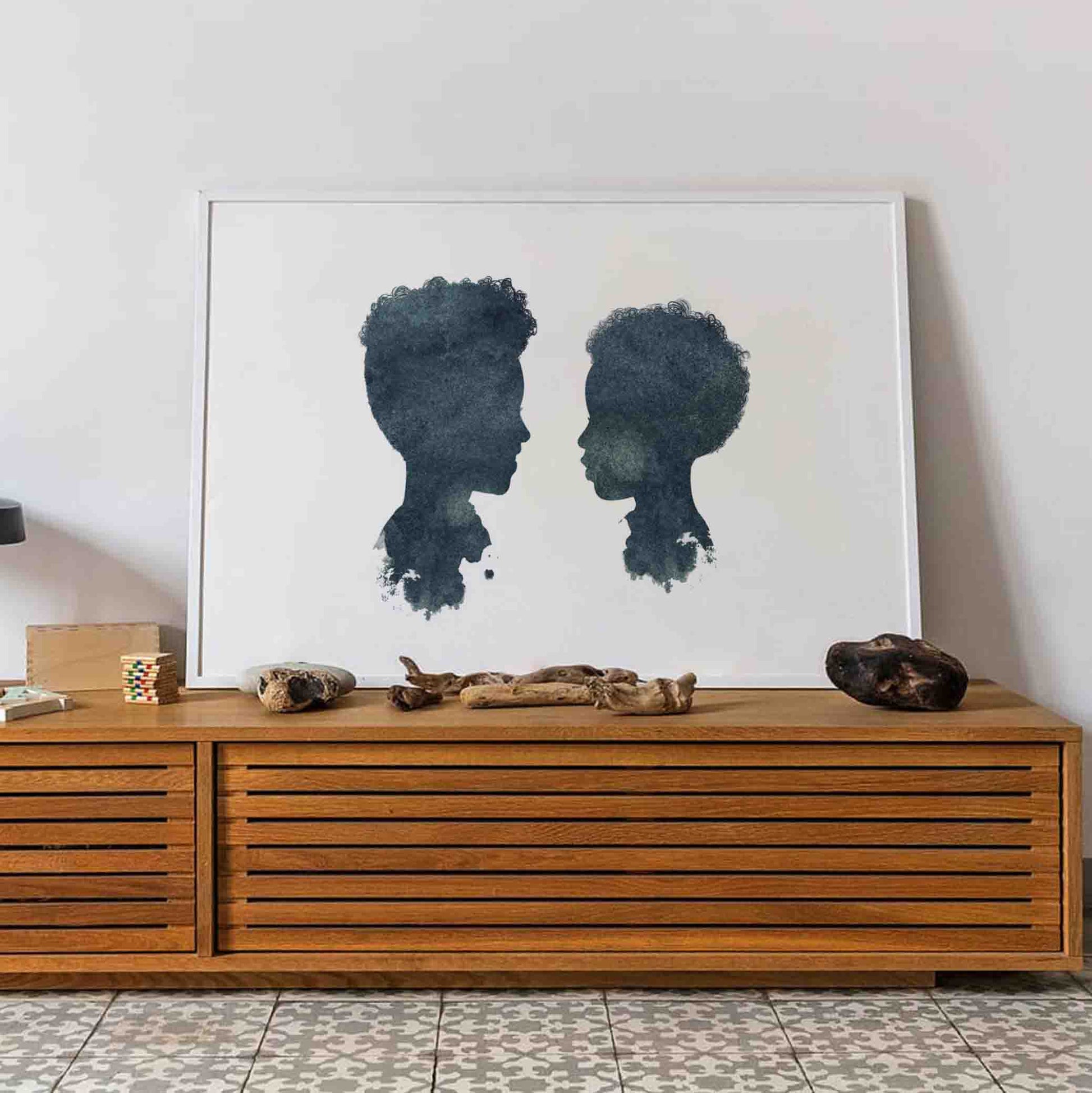 Silhouette portrait of two siblings – custom illustrated artwork from Burnt Peach, made to last a lifetime.