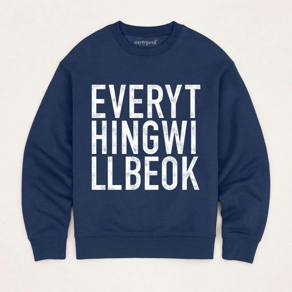 Oversized, organic unisex sweatshirt in navy with bold vintage style typography in white saying "Everything will be ok"  Photographed  as a flay lay on a plain background. 