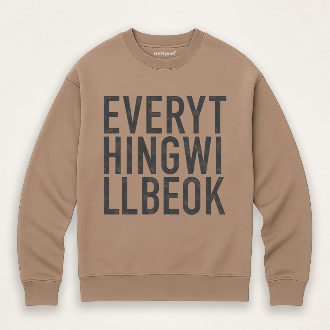 Driftwood colour oversized, organic unisex sweatshirt with bold vintage style typography in white saying "Everything will be ok"  Photographed  as a flay lay on a plain background. 