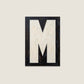 Letter M oil paint texture typography print on off white background
