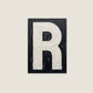 Letter R oil paint texture typography print on off white background