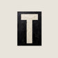 Letter T oil paint texture typography print on off white background