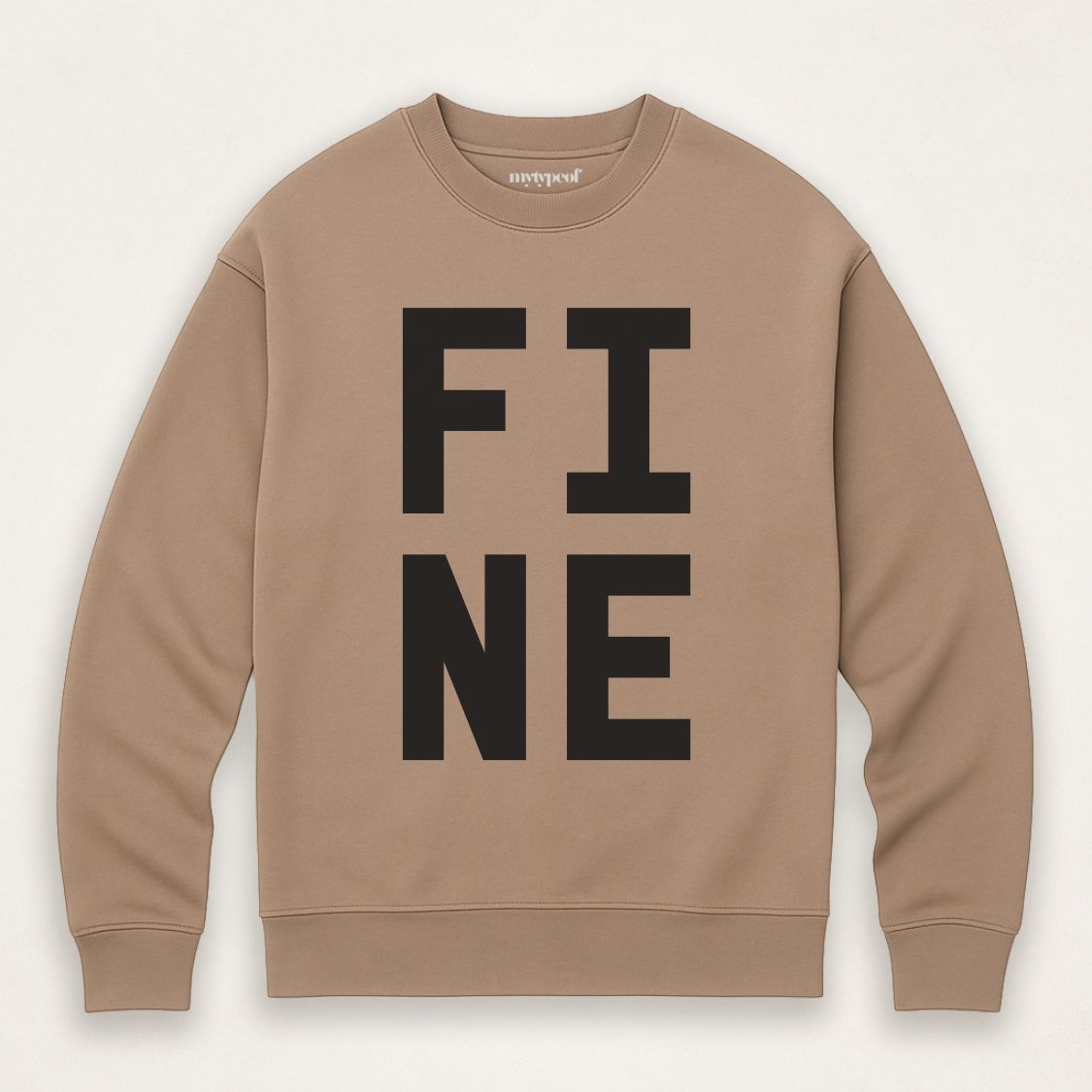 Brown caramel colour bold typographic designed sweatshirt, with 'FINE' design. Unisex, oversized sweatshirt, photographed  as a flay lay on a plain background. 