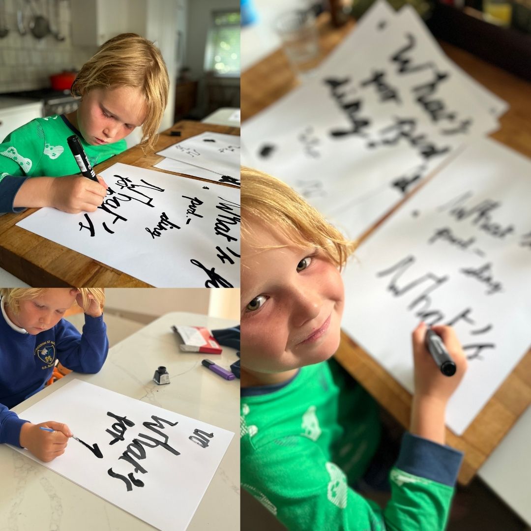 Little boy handwriting the "What's for pudding?" quote to be used in the design by burntpeach.co.uk 