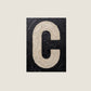 Letter C oil paint texture typography print on off white background