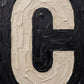 Close up of Letter C oil paint texture typography print on off white background