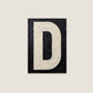 Letter D oil paint texture typography print on off white background