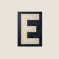 Letter E oil paint texture typography print on off white background