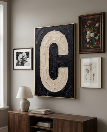 Letter C oil paint art print framed in brass styled on a gallery wall over a sideboard. 
