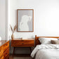 silhouette portrait in Pantones colour of the year, cloud dancer, styled in a mid century bedroom. 