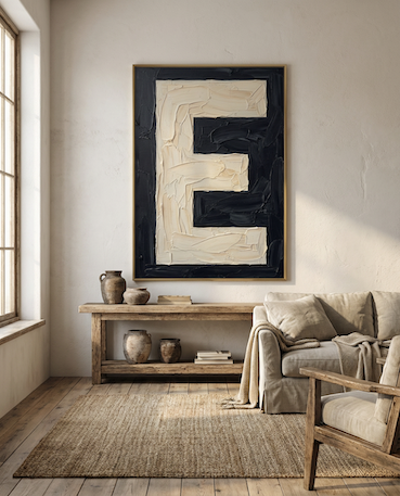 Letter E oil paint art print framed in oak frame styled in a rustic interiror with sofa and large window i
