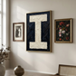 Letter I oil paint art print framed in brass styled in a  mid century  interior with large window and other framed prints. 