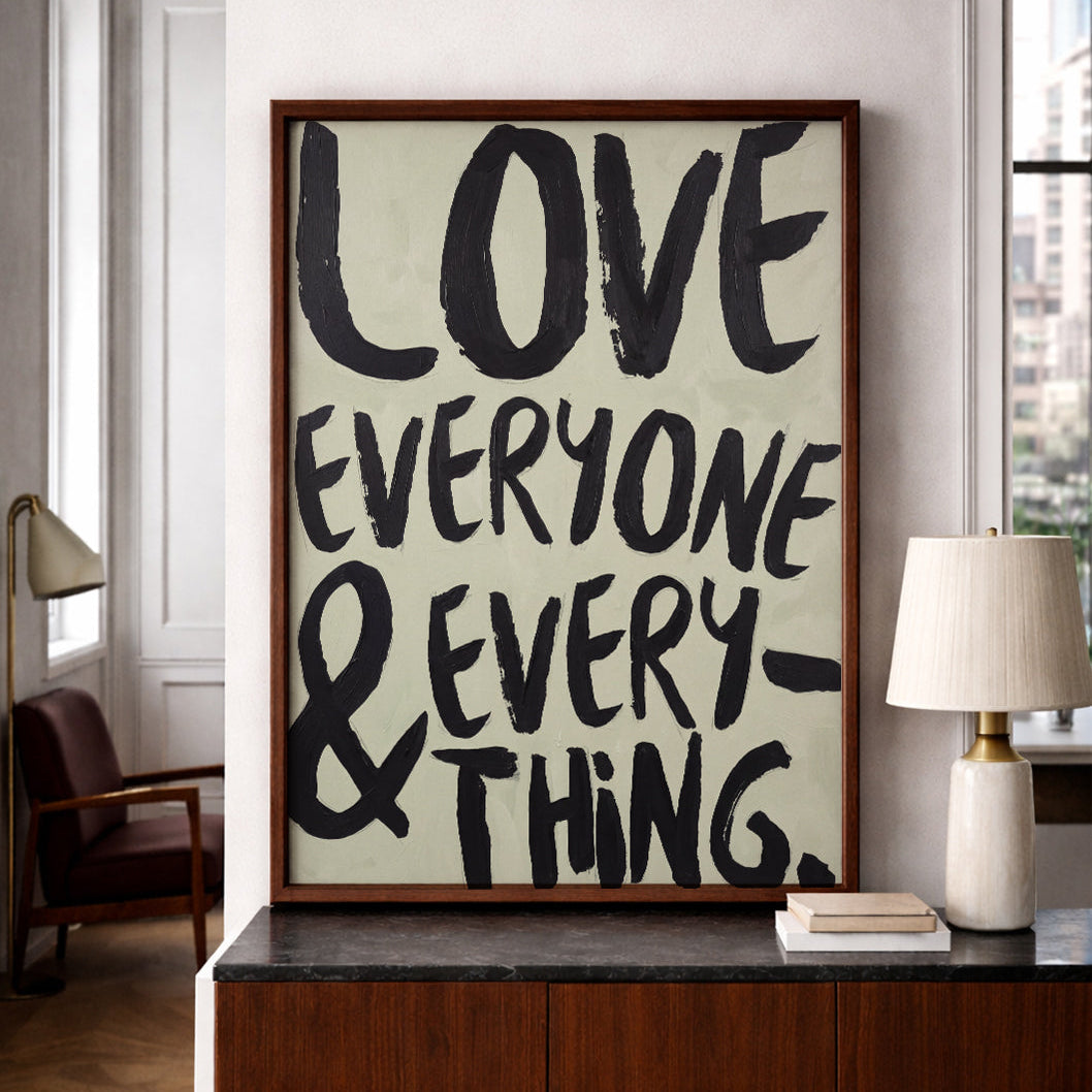 Love Everyone and Everything inspirational typography print styled in a modern neutral living room.