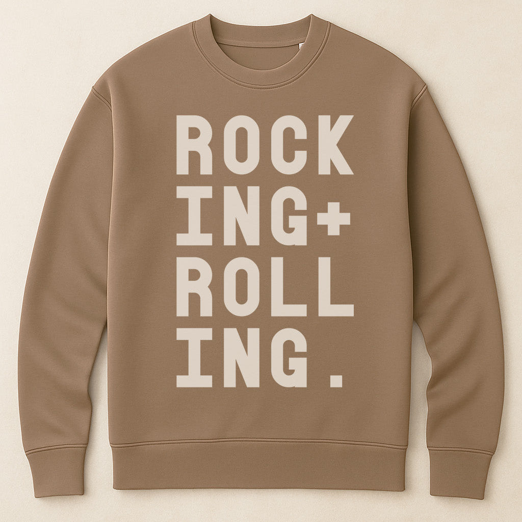Rocking and Rolling bold typographic sweatshirt on neutral brown sweatshirt by Burnt Peach. 