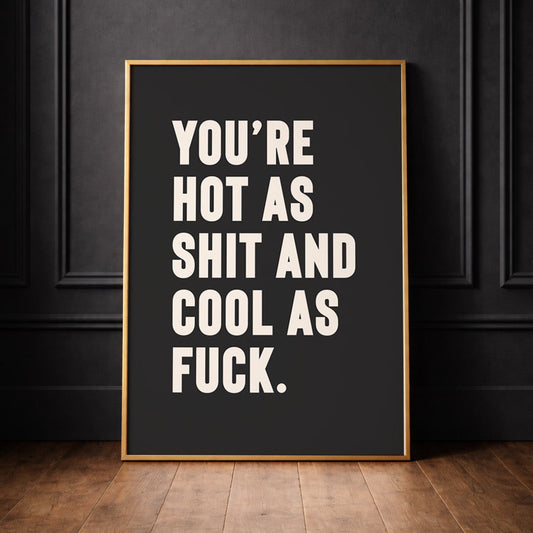 Cool sweaty wall at typography quote print in black and white, leaning against a black panelled wall, print reads "your hot as shit and cool as fuck" perfect for valentines anniversary gifts. 