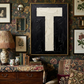 Letter T oil paint art print framed in a brass frame, in a gallery wall, maximalist styled interior. 