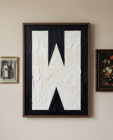 Letter W oil paint art print framed in a wooden frame, in a gallery wall on white wall. 