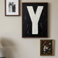 Letter Y oil paint art print framed in a wooden frame, in a gallery wall on white wall. 