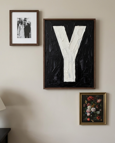 Letter Y oil paint art print framed in a wooden frame, in a gallery wall on white wall. 