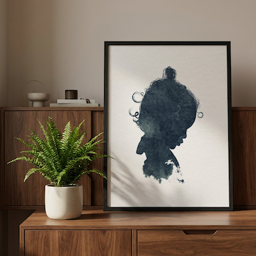Girls ink silhouette portrait styled on midcentury sideboard next to plant. 